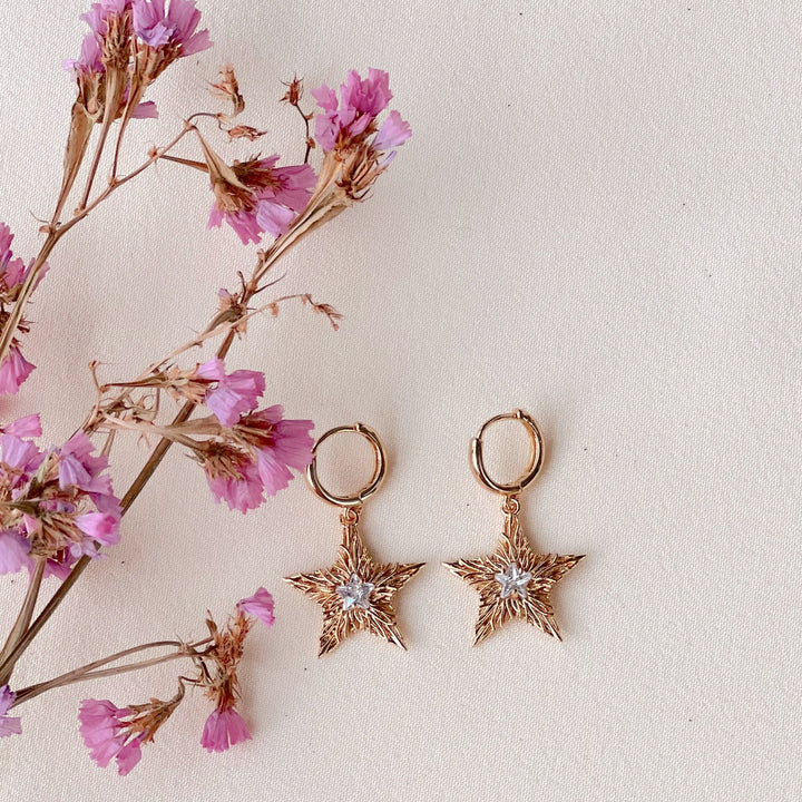 Asteri Hoops Dangle Earrings - Golden Star Charms with Crystal Centers and Rhodium Plating